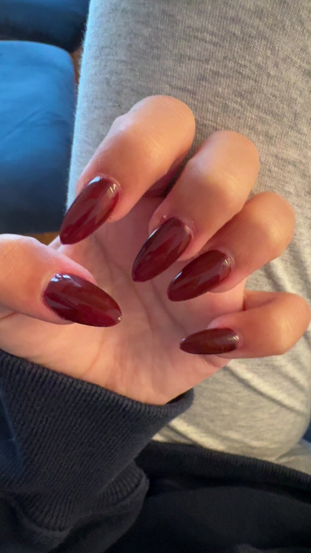 Glossy deep red almond nails